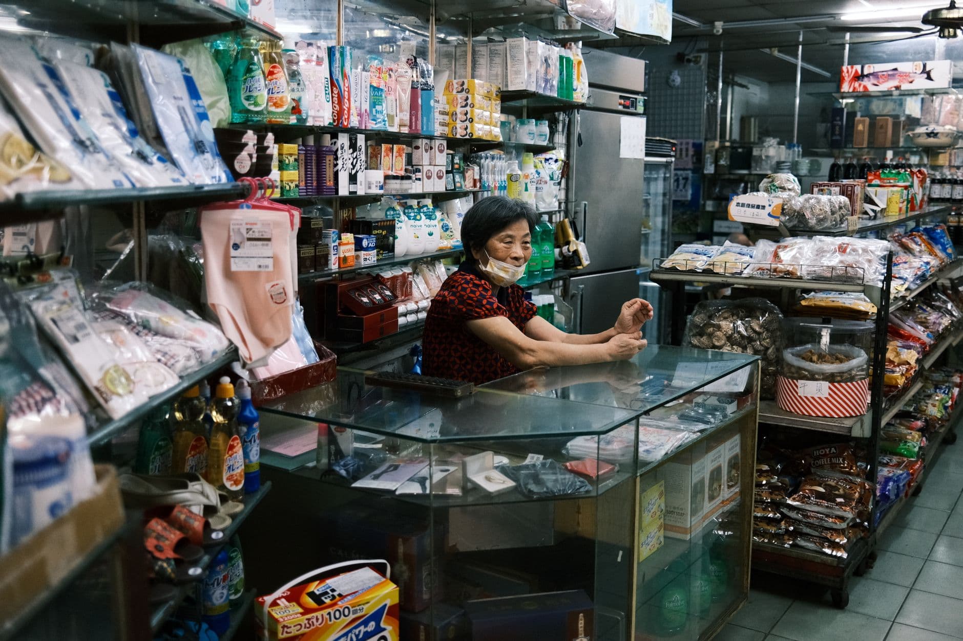 An independent shop owner behind the counter — the real decision-maker for indie retail